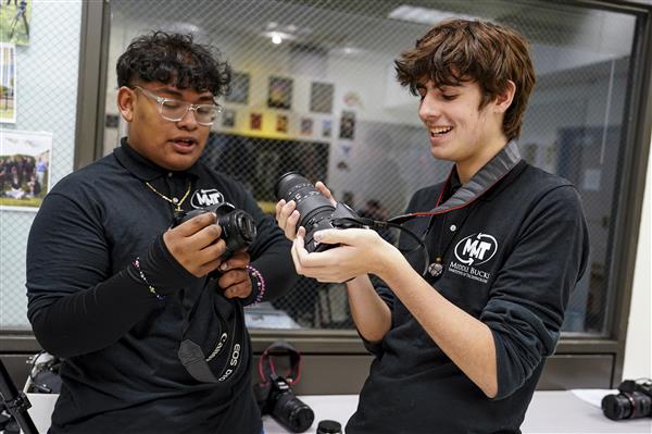 MULTIMEDIA TECHNOLOGY students working with cameras